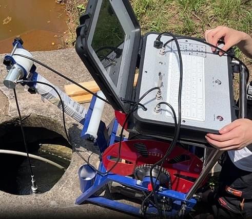 High-definition borehole inspection camera in operation