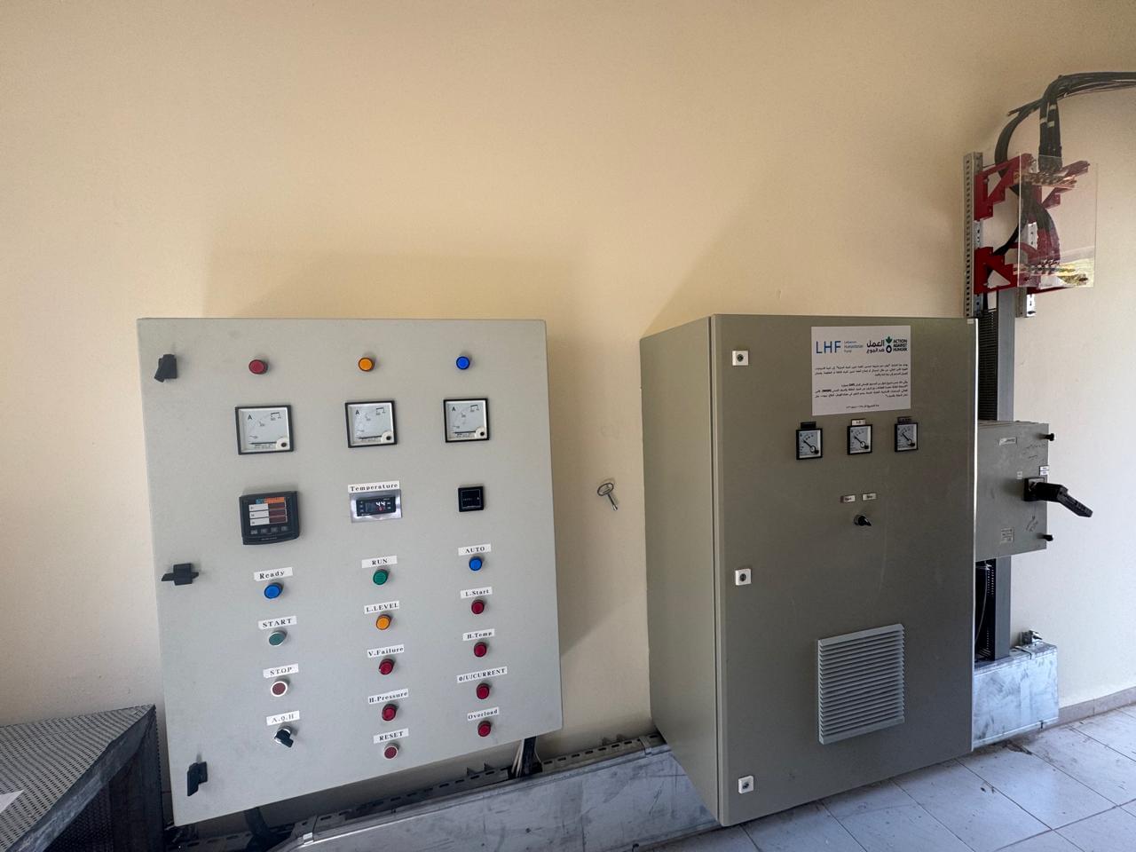 Industrial electrical panel installation with conduit routing