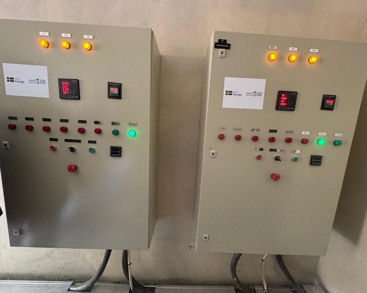 Electrical technicians commissioning industrial control systems