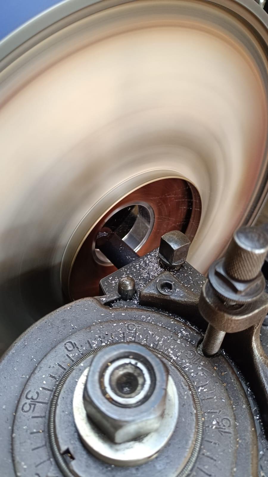 Precision lathing of pump impeller on industrial lathe